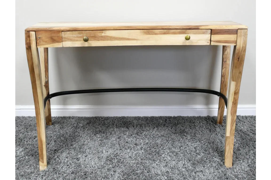 Natural wood console table with two drawers and curved metal support on grey carpet