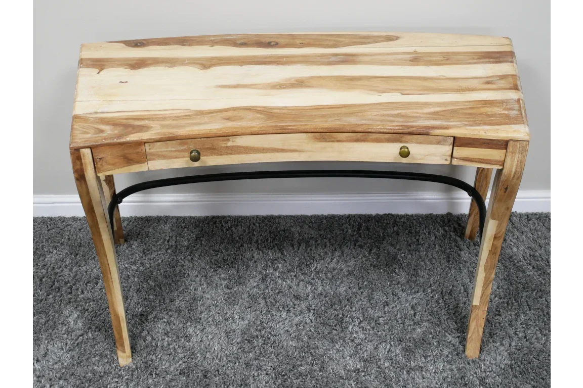 Solid wood writing desk with two drawers and black metal support on grey carpet