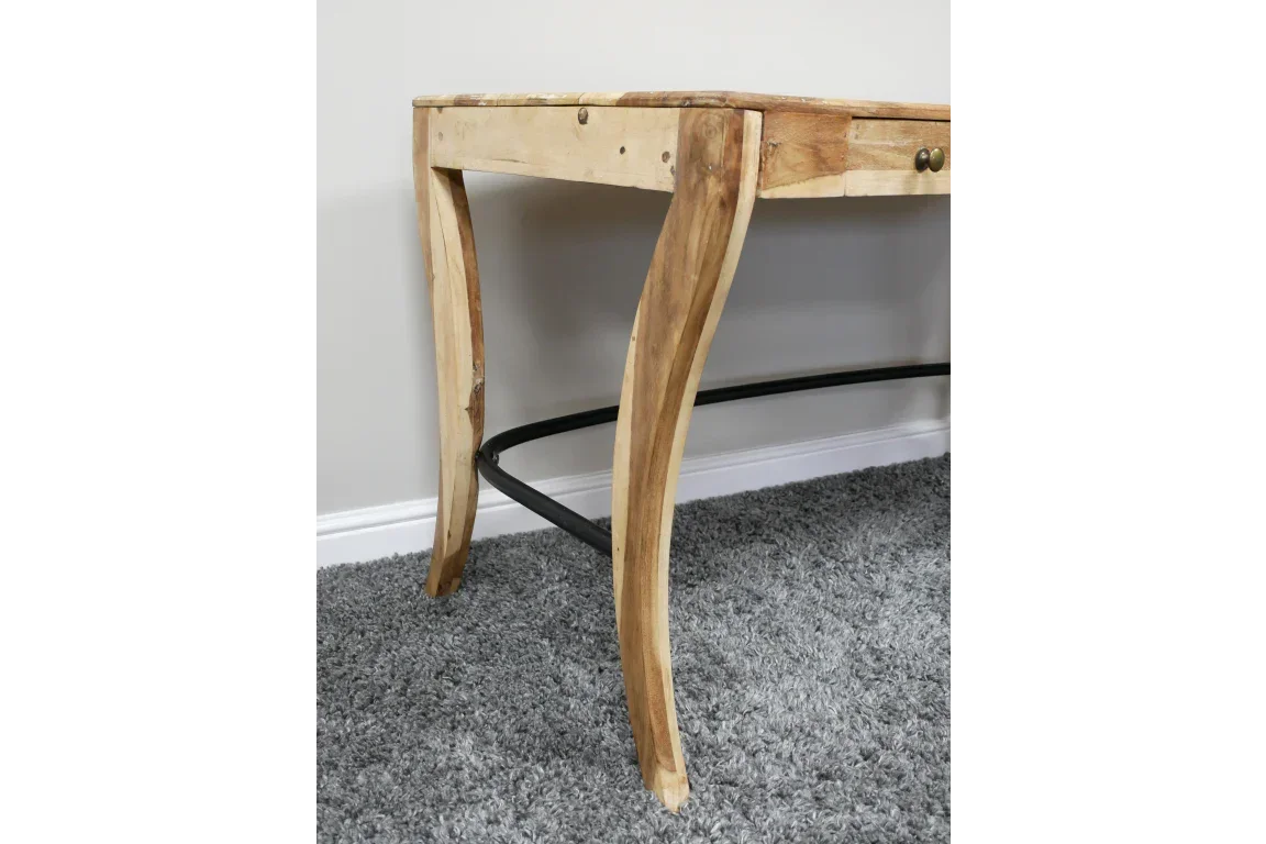 Solid wood console table with curved legs and drawer, closeup on grey carpet