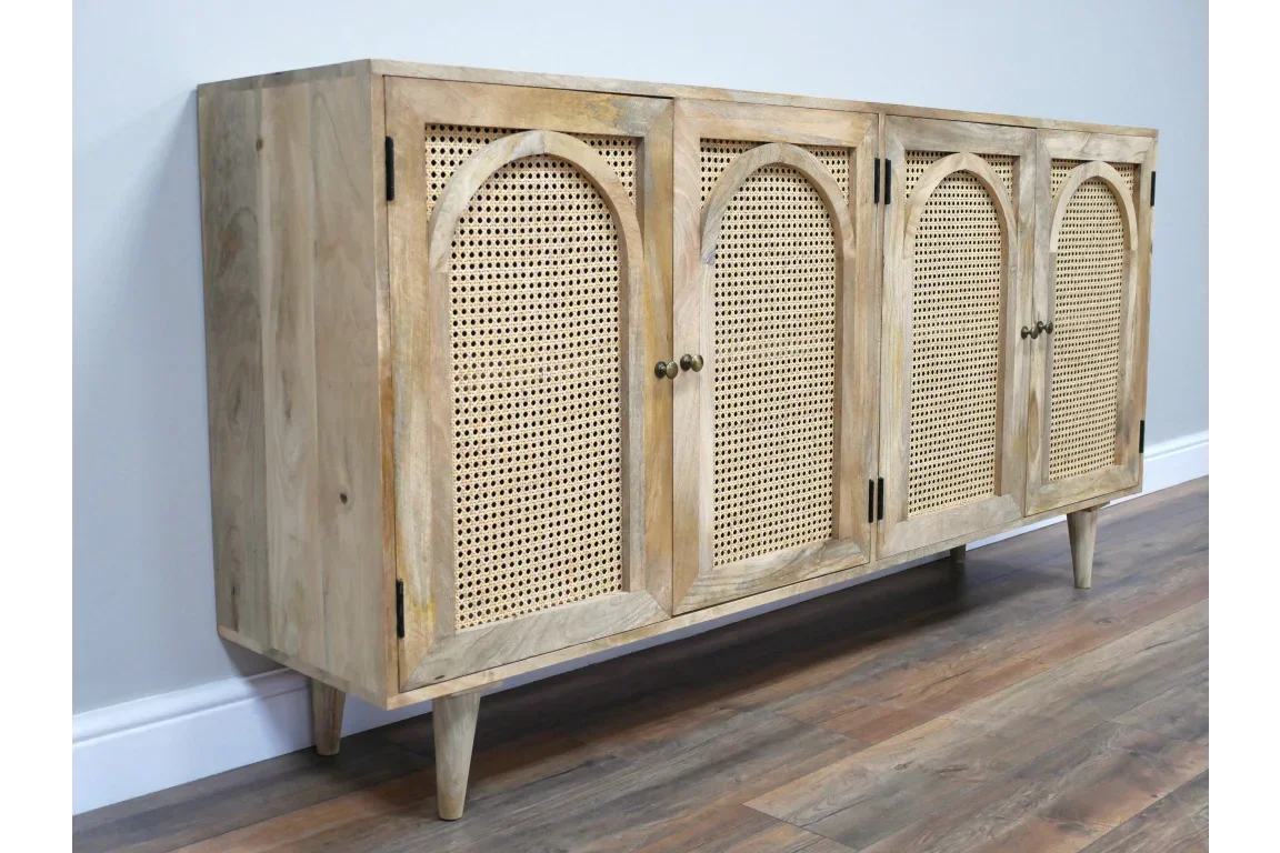 Natural wood sideboard with four cane front doors and arched detailing on tapered legs