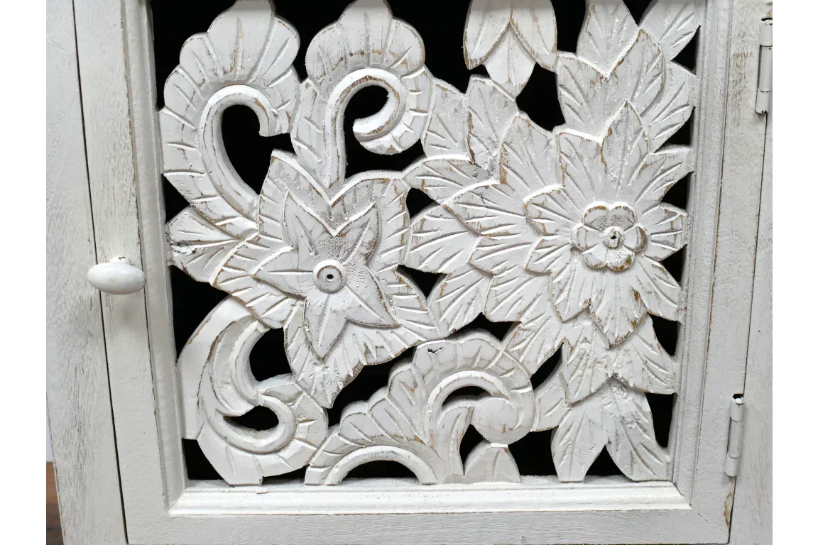White carved wood cabinet door with floral pattern and distressed finish