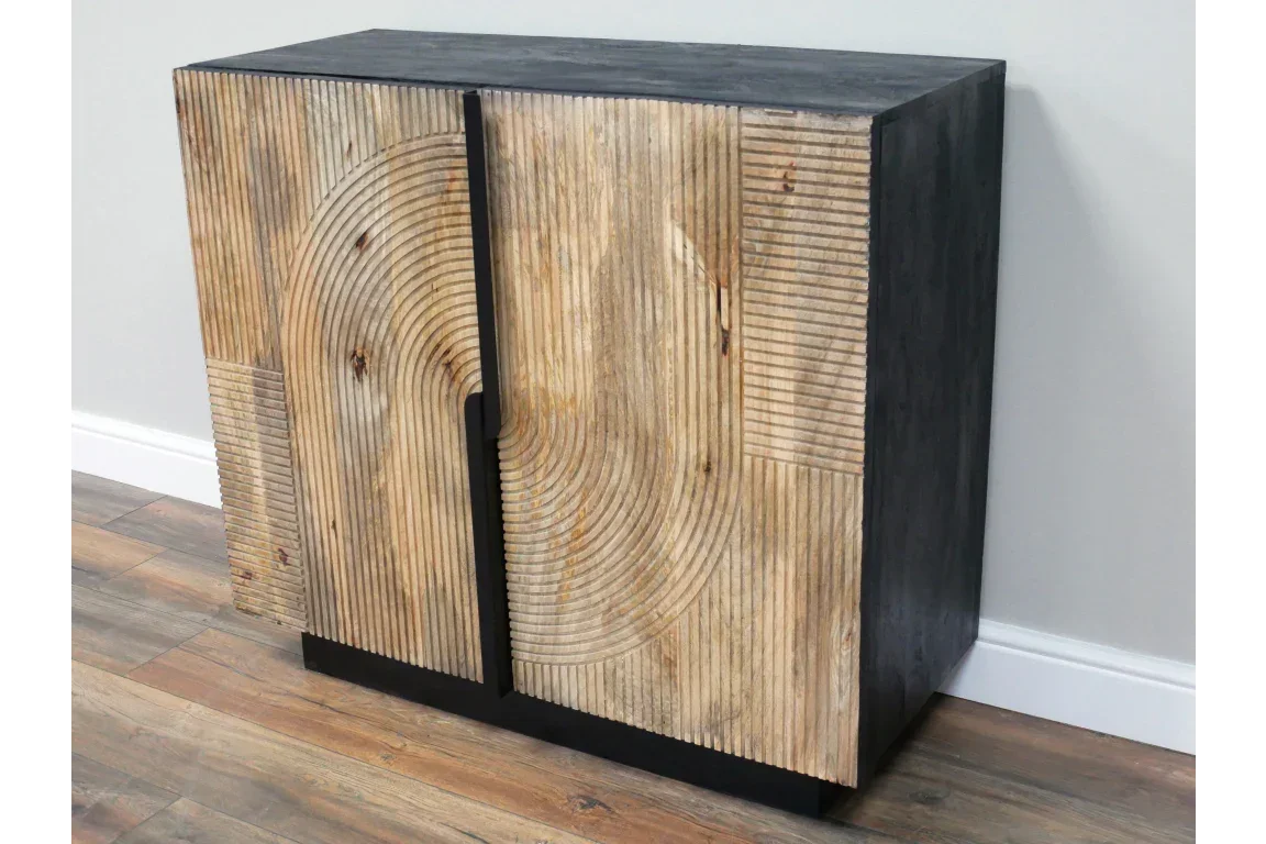 Modern wooden sideboard with geometric carved doors and dark frame on wood flooring