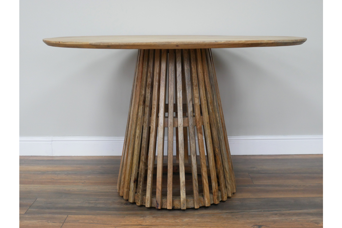 Round wooden dining table with slatted conical base, natural wood finish, viewed front on against neutral wall.
