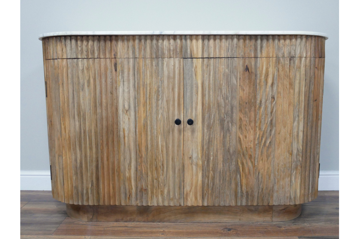 Curved wooden sideboard with vertical slats, natural finish, black knobs, and white marble top, front view.