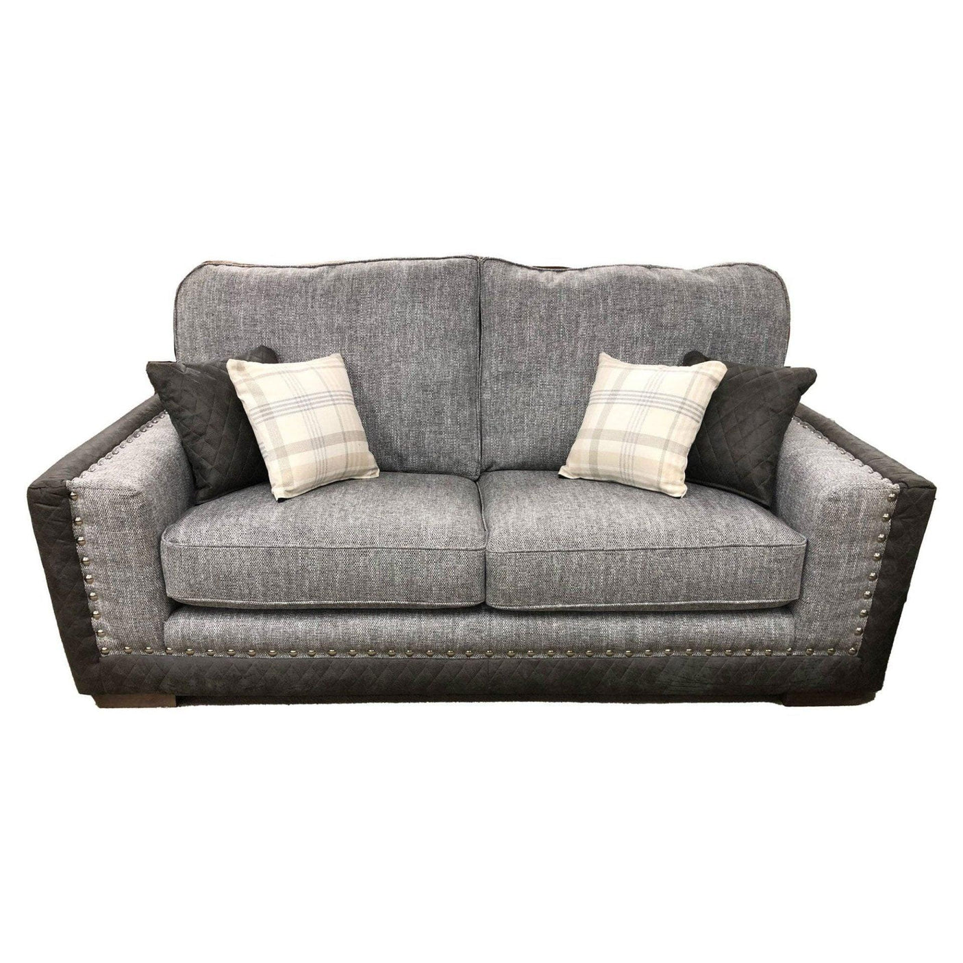 Grey fabric sofa with studded trim, quilted armrests, and four scatter cushions
