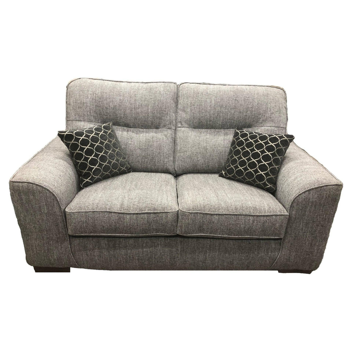 Grey woven fabric two-seater sofa with dark patterned scatter cushions, front view