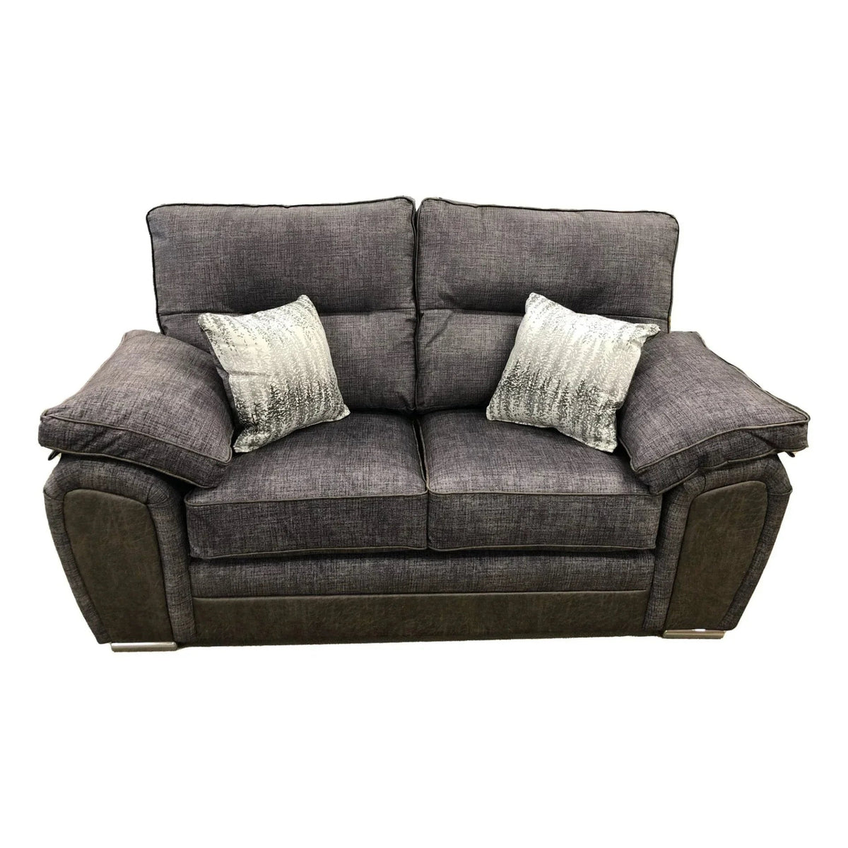 Grey fabric two-seater sofa with brown trim and two patterned scatter cushions, front view