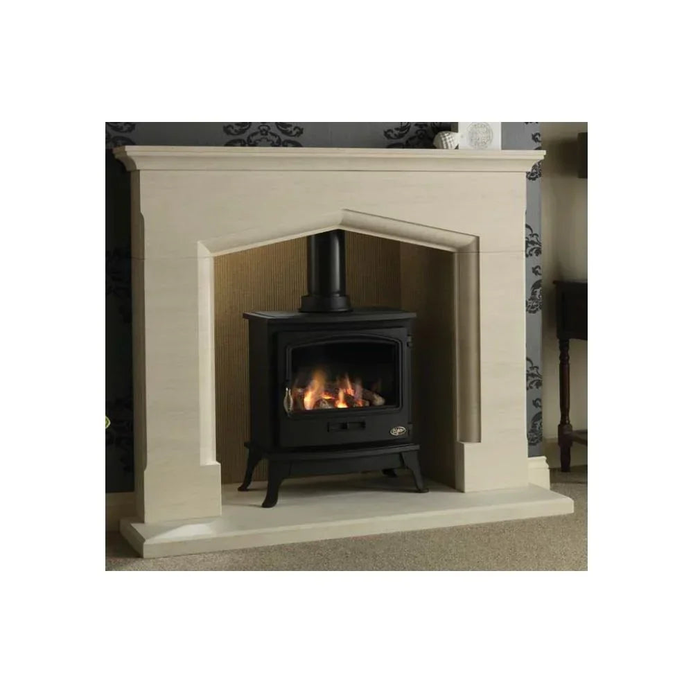 Black wood burning stove with visible flames set in cream stone fireplace surround