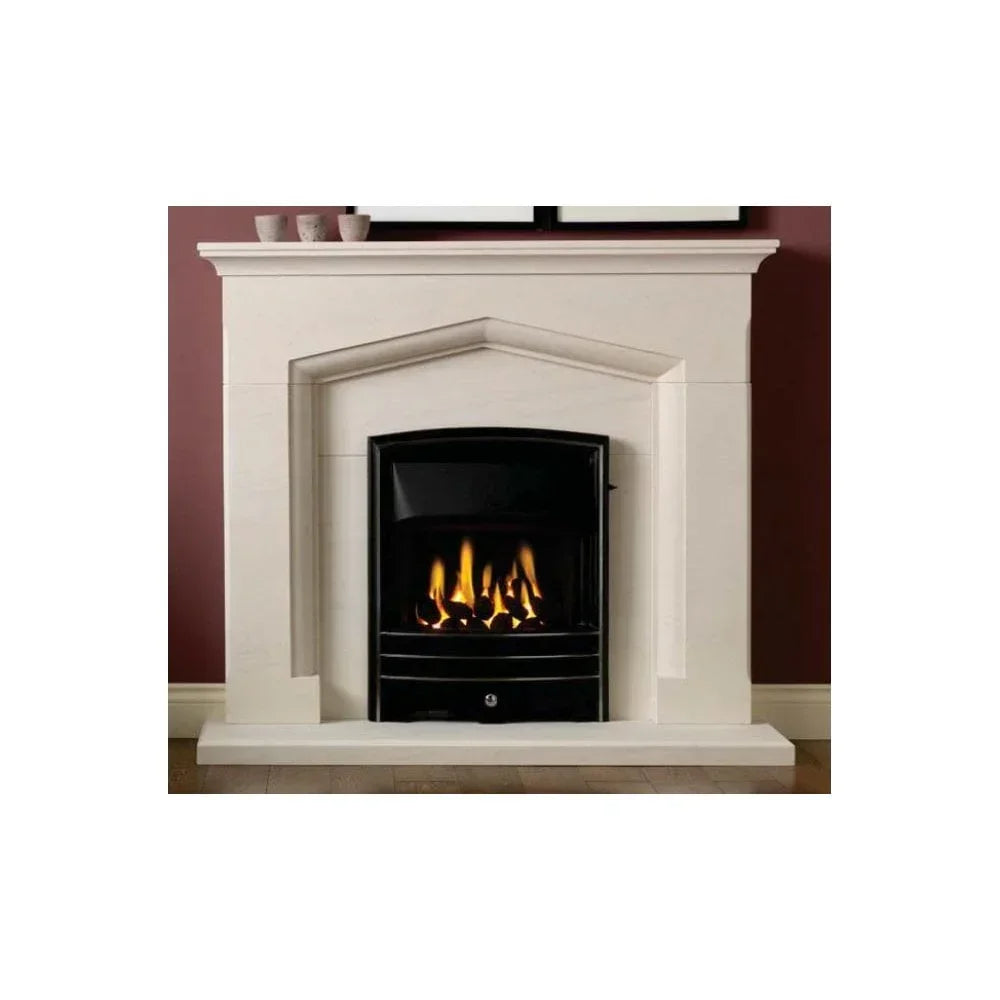 Modern gas fireplace with cream stone surround against maroon wall on hardwood floor