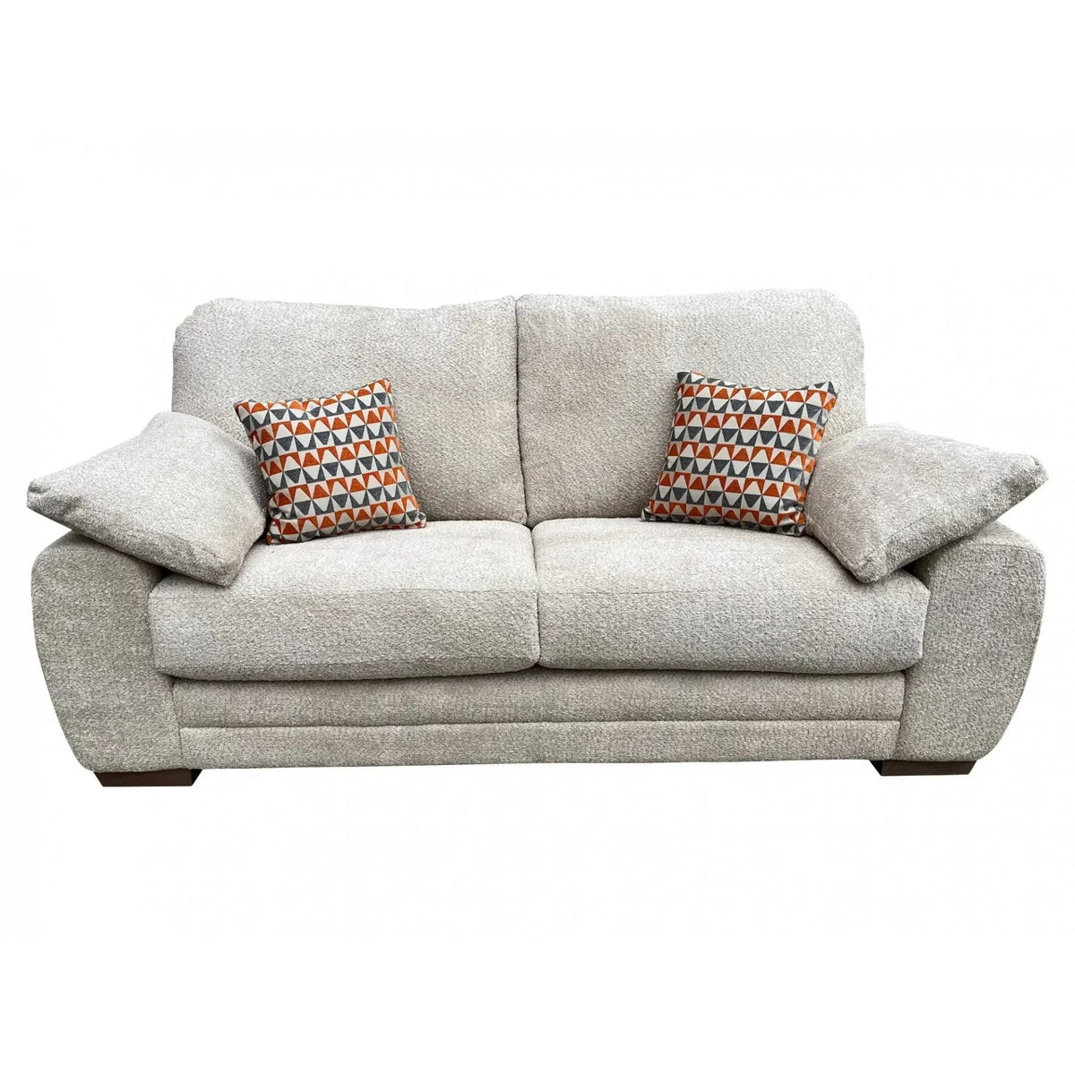 Light grey boucle sofa with orange and navy triangle-print scatter cushions