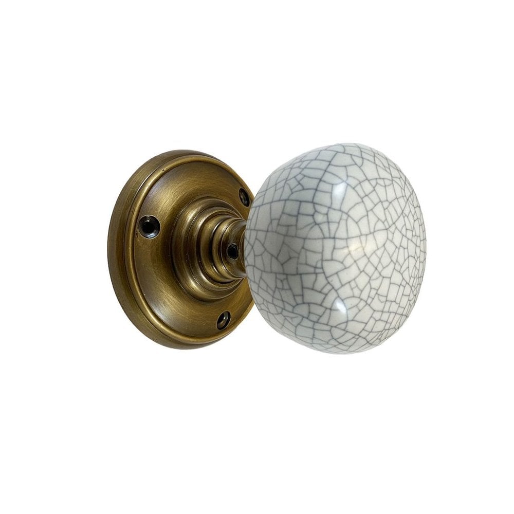 Portroe Antique Brass Porcelain Knob With Spring