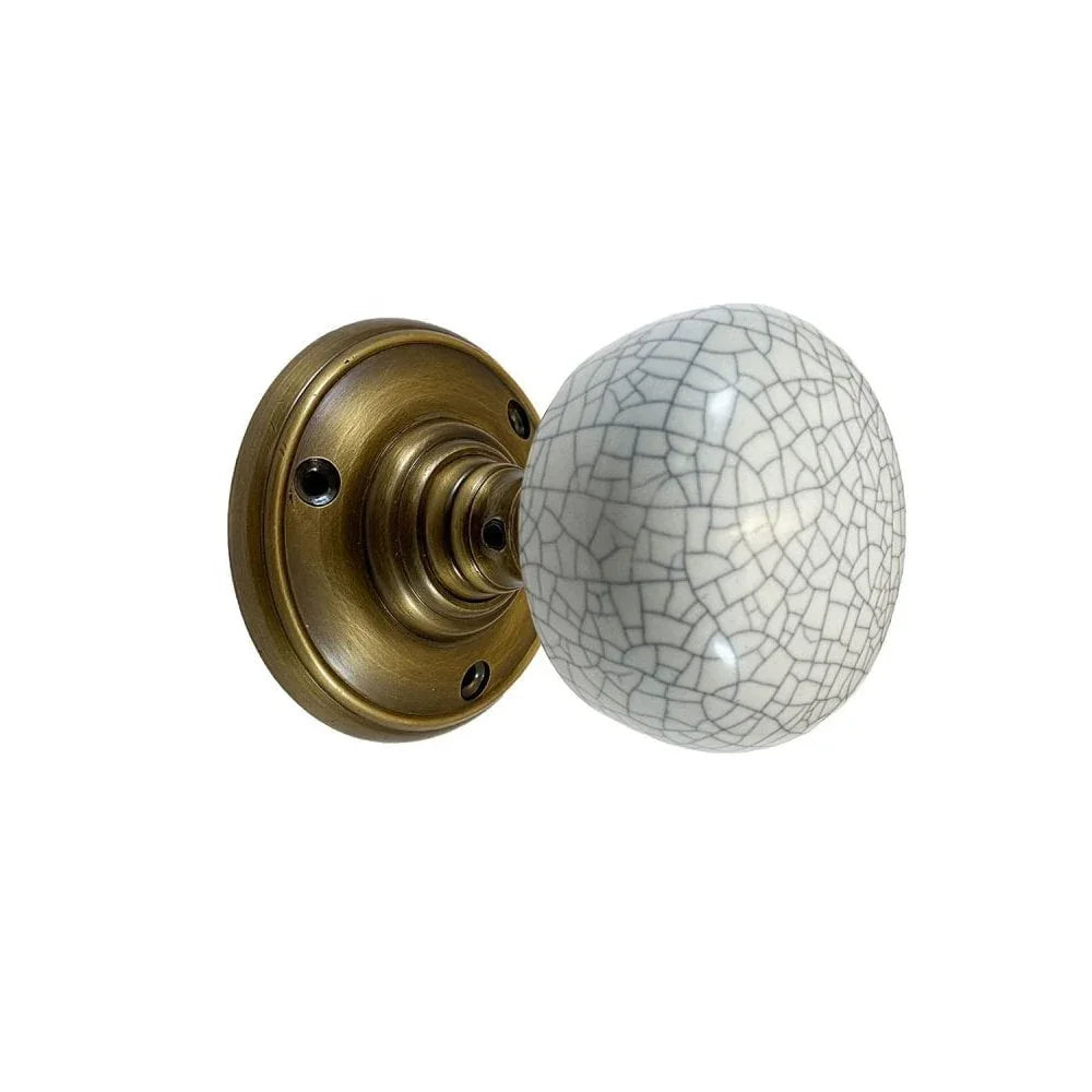 Portroe Antique Brass Porcelain Knob With Spring