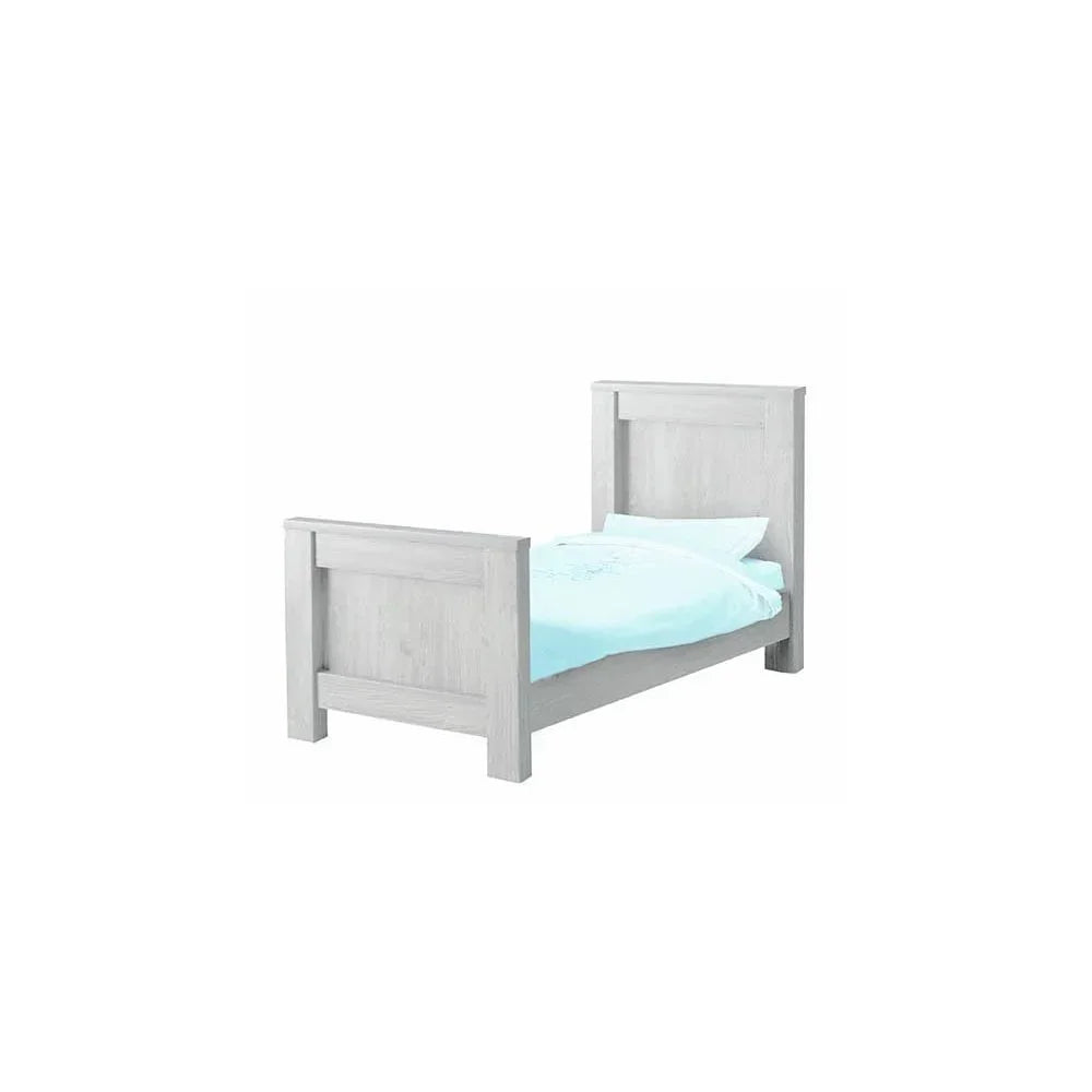 White wooden single bed frame with headboard and footboard, light blue bedding