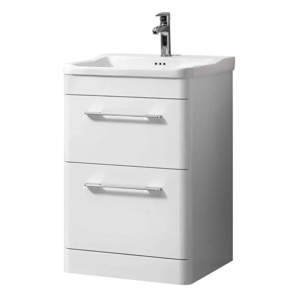 White bathroom vanity unit with two drawers and chrome handles, integrated basin and tap