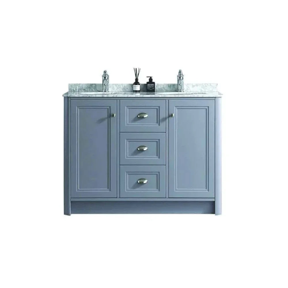 Blue double vanity unit with marble top, central drawers, cupboards, and twin sink fittings