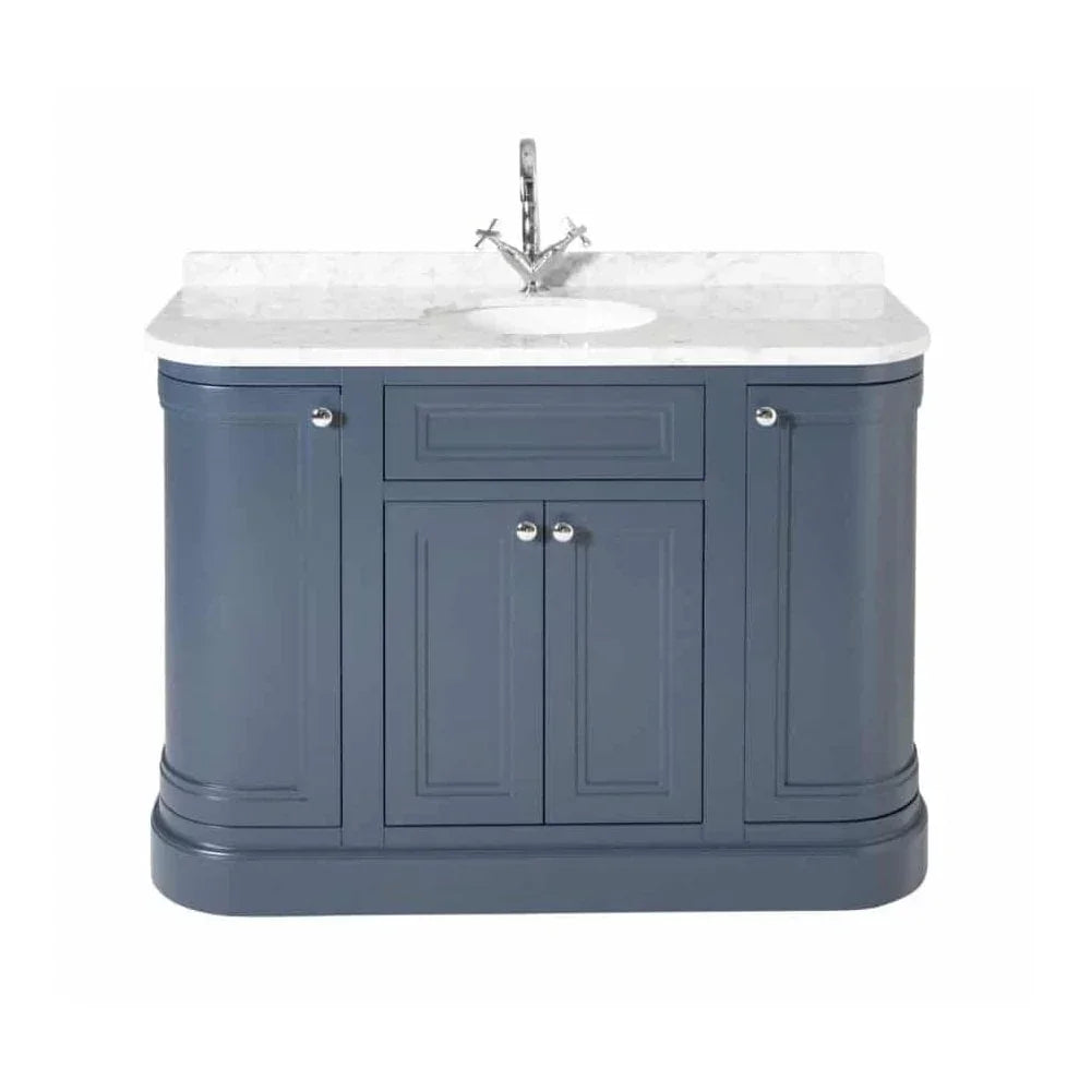 Navy blue bathroom vanity unit with white marble top and chrome faucet
