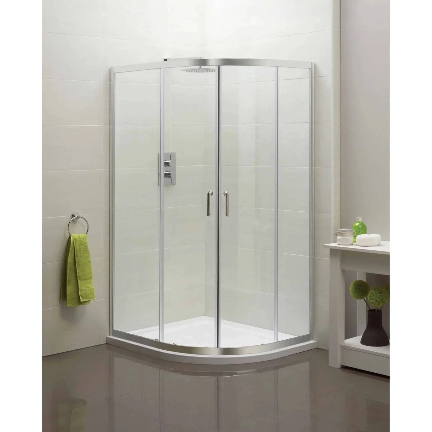 Corner shower enclosure with glass doors and chrome handles in modern bathroom