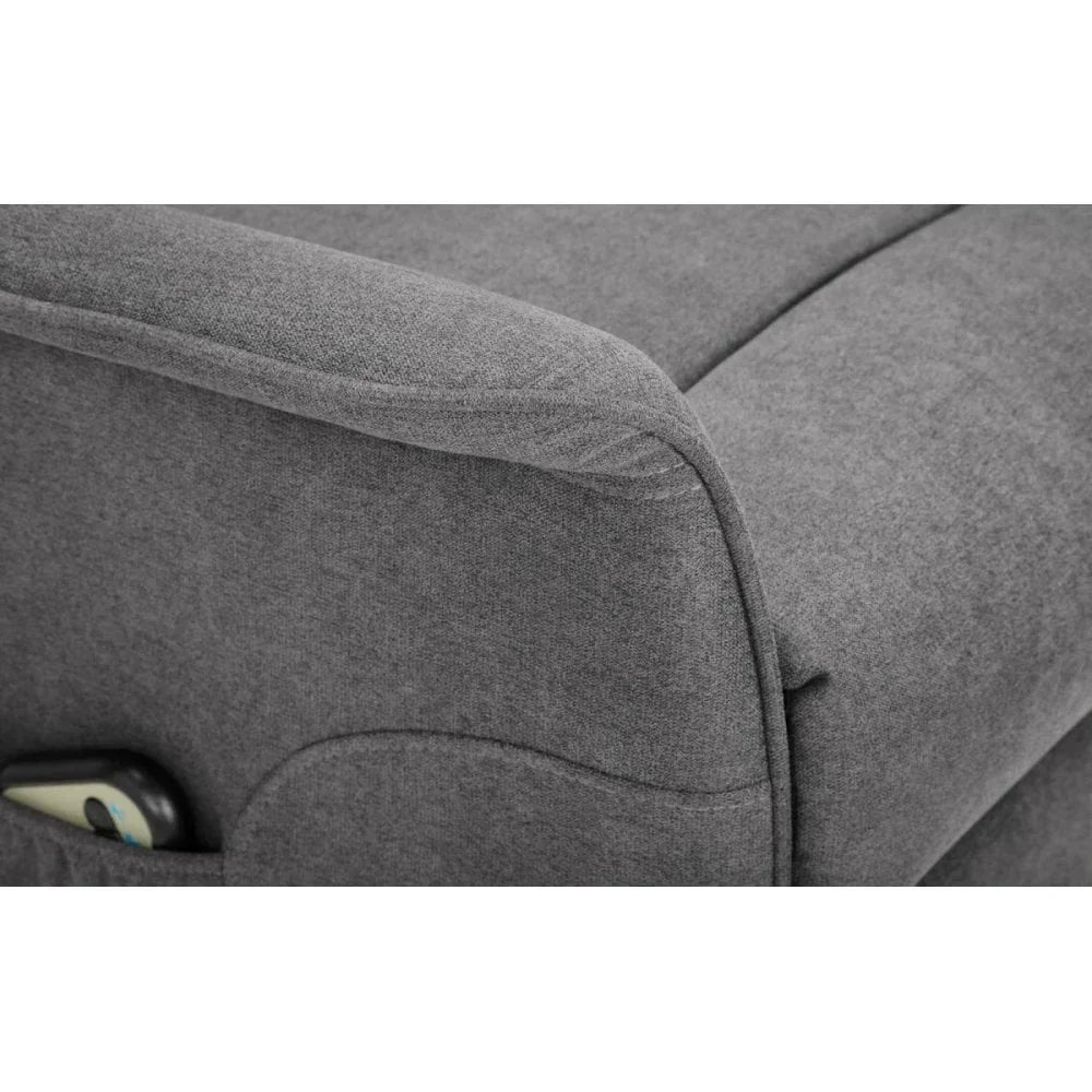 Grey fabric sofa arm with built-in side pocket holding a phone