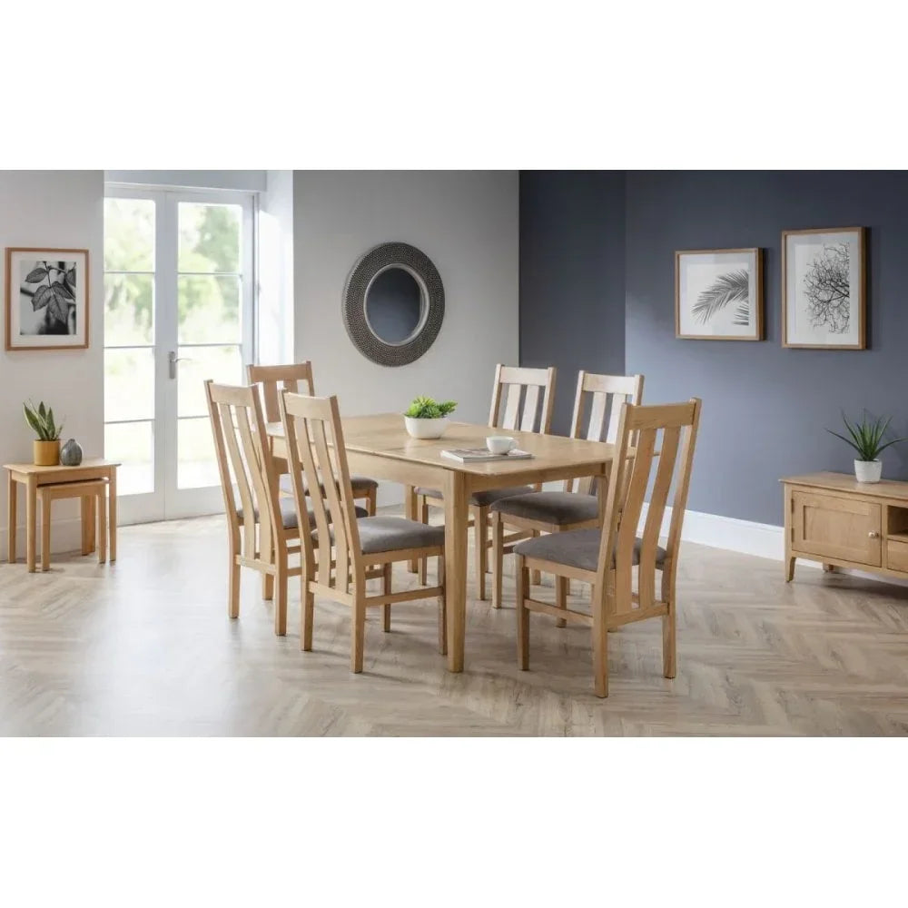Oak dining table set with six upholstered chairs in modern dining room