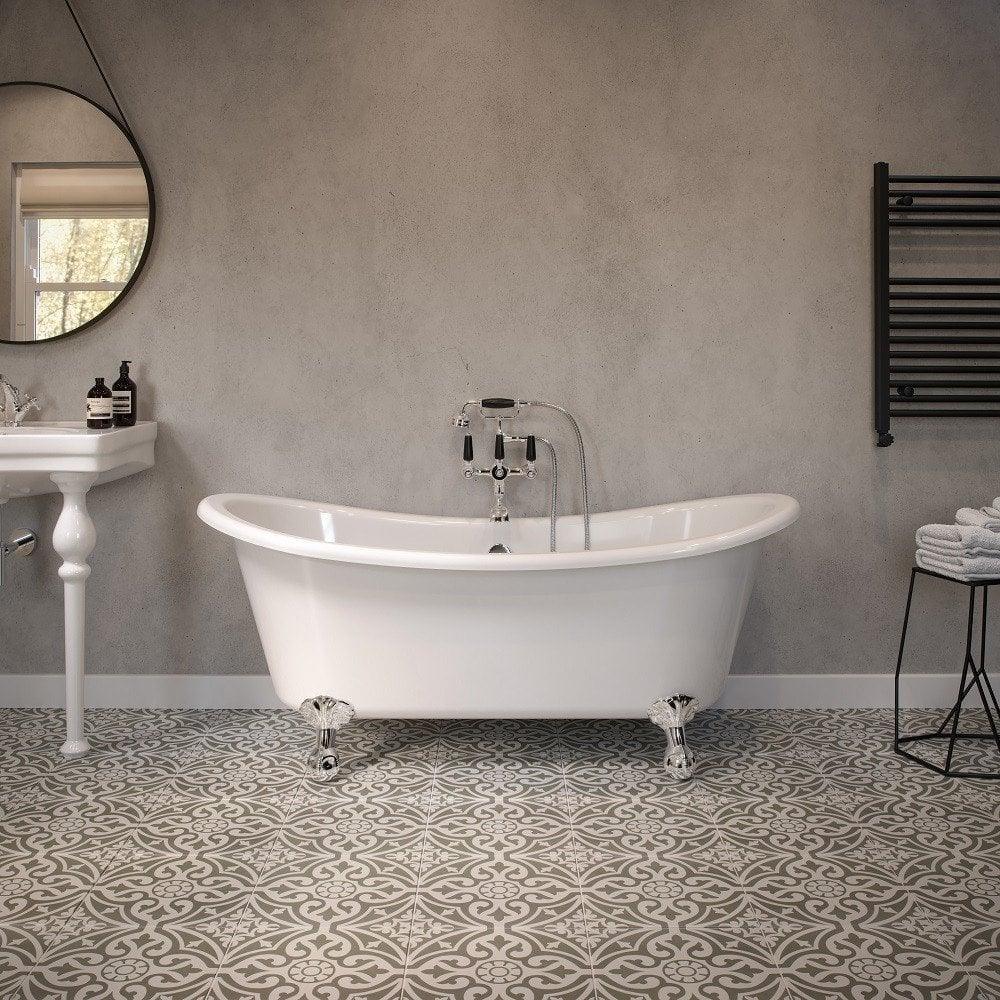 Freestanding white clawfoot bath in modern bathroom with patterned floor tiles