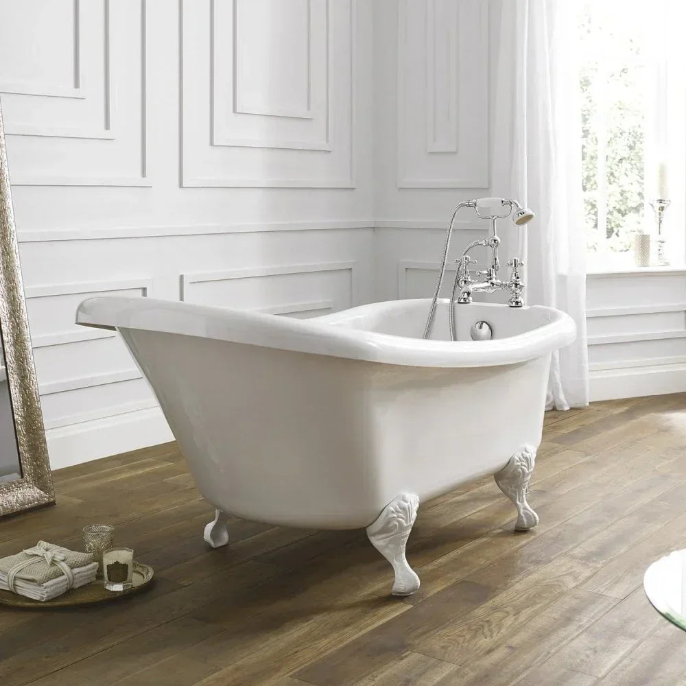 White freestanding clawfoot bath with chrome tap in classic paneled bathroom on wood floor
