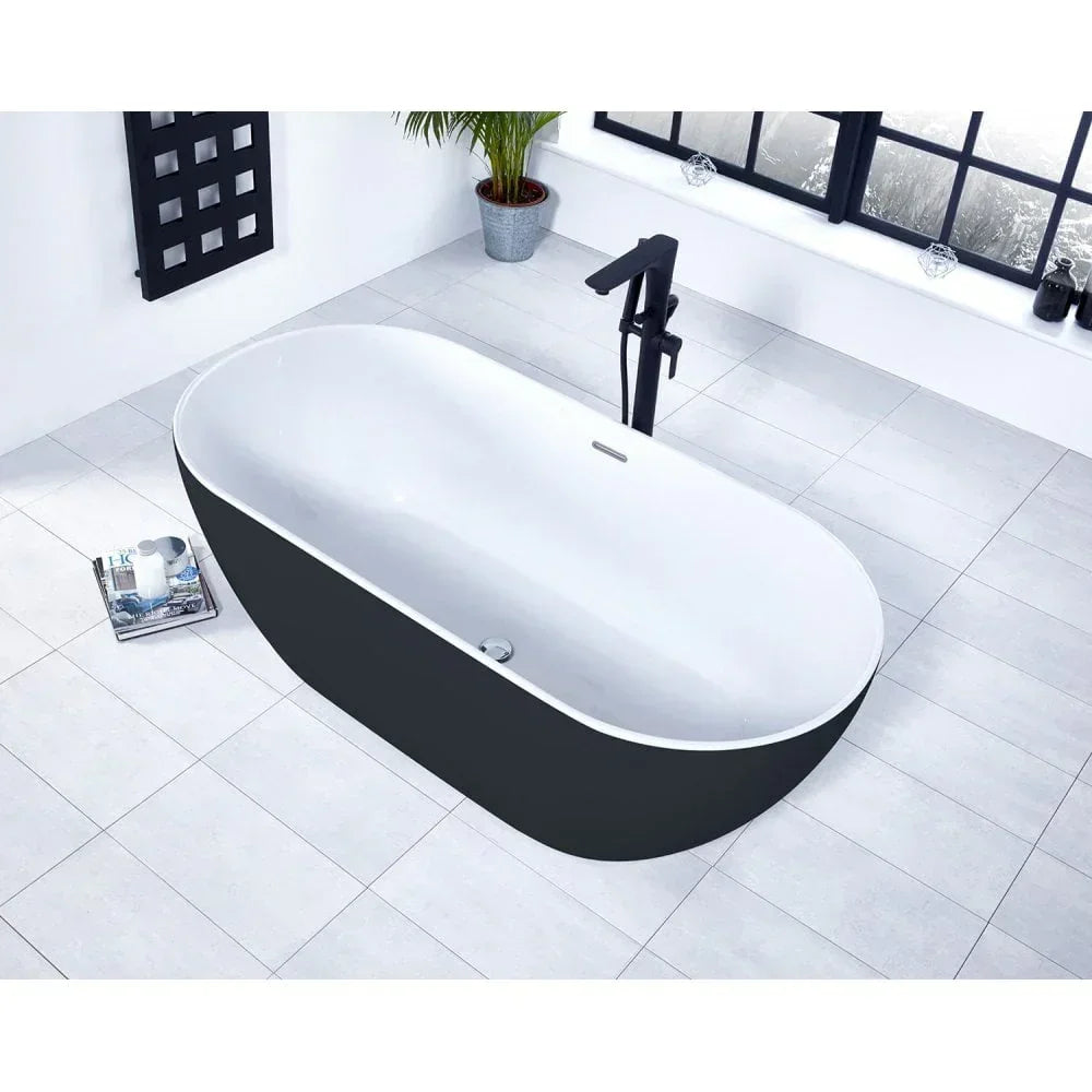 Freestanding black and white bathtub with floor mounted tap in modern tiled bathroom