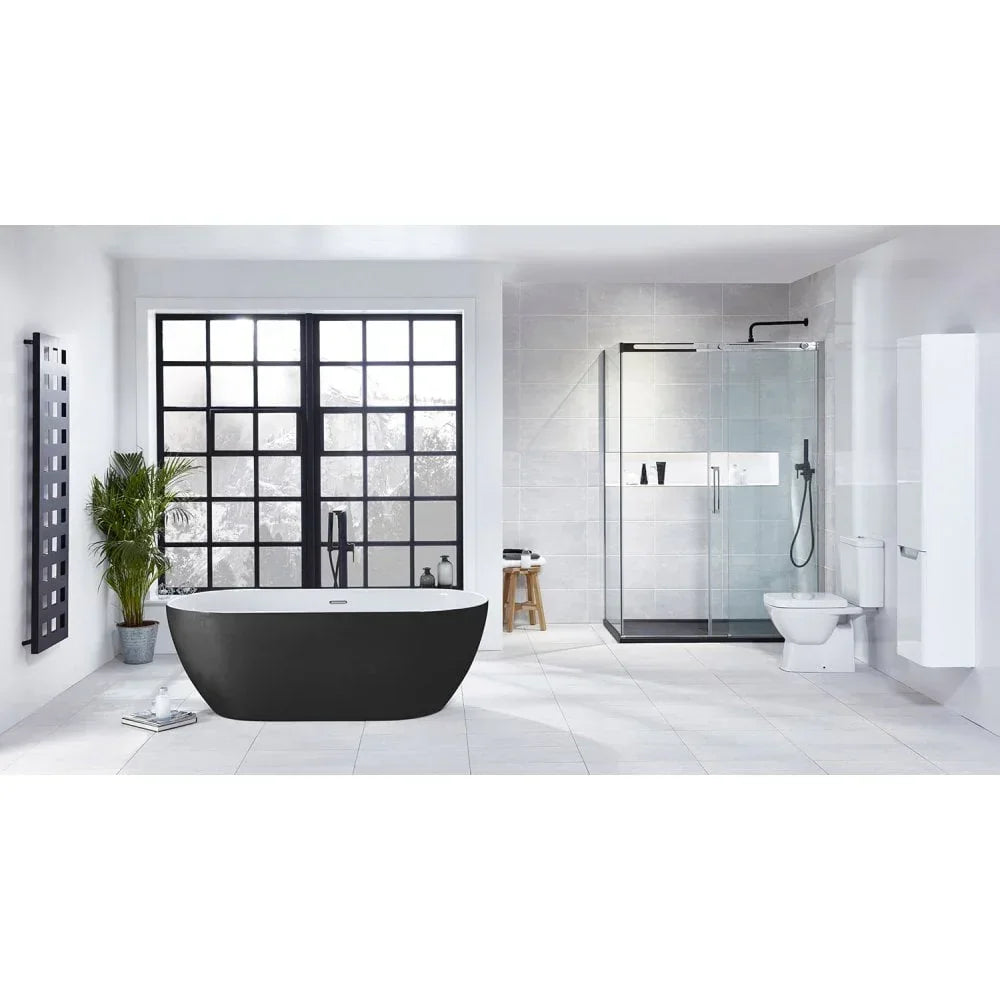Modern bathroom with freestanding black bath, glass shower enclosure and white toilet