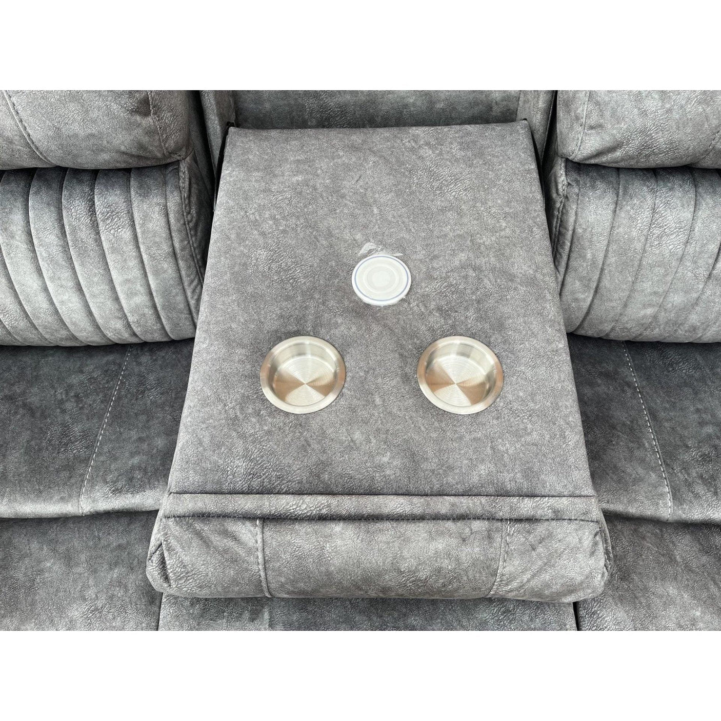 Grey fabric sofa armrest with built-in cup holders and USB charging port
