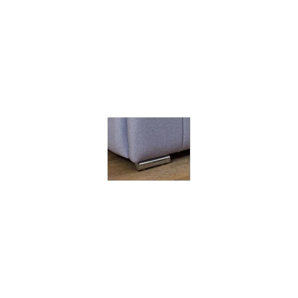 Close up of sofa chrome leg on wooden floor with grey upholstery