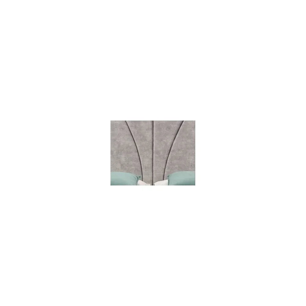 Close-up of grey upholstered bed headboard with stitching detail and teal bedding