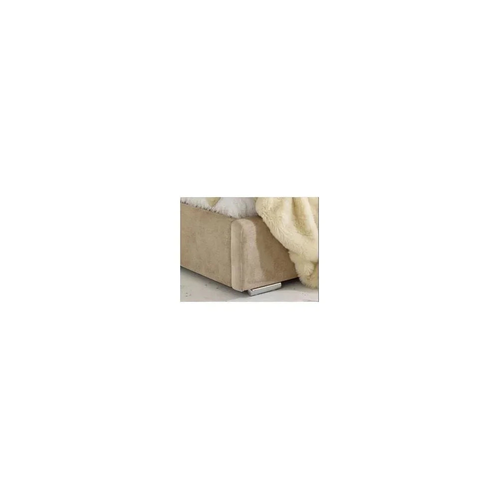 Beige fabric sofa corner with chrome leg and cosy throw blanket