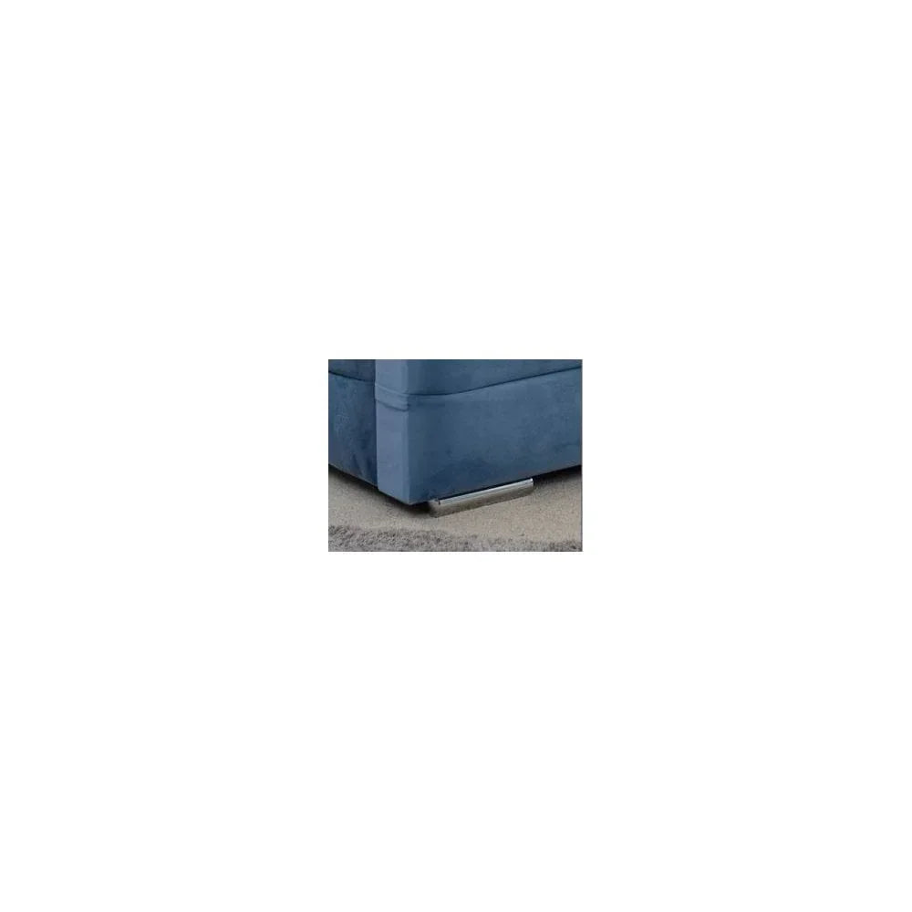 Blue fabric sofa corner with chrome leg on grey carpet
