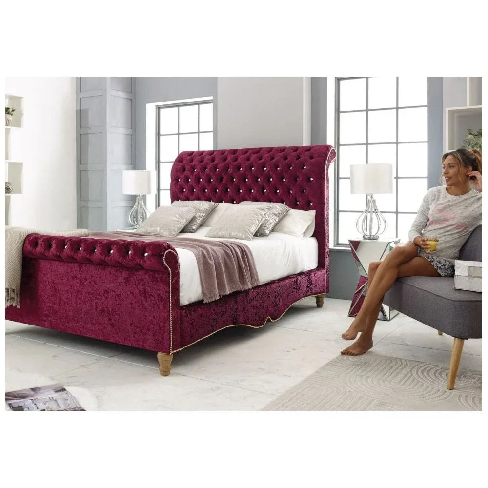 Plush velvet sleigh bed with deep button tufting in a modern bedroom setting