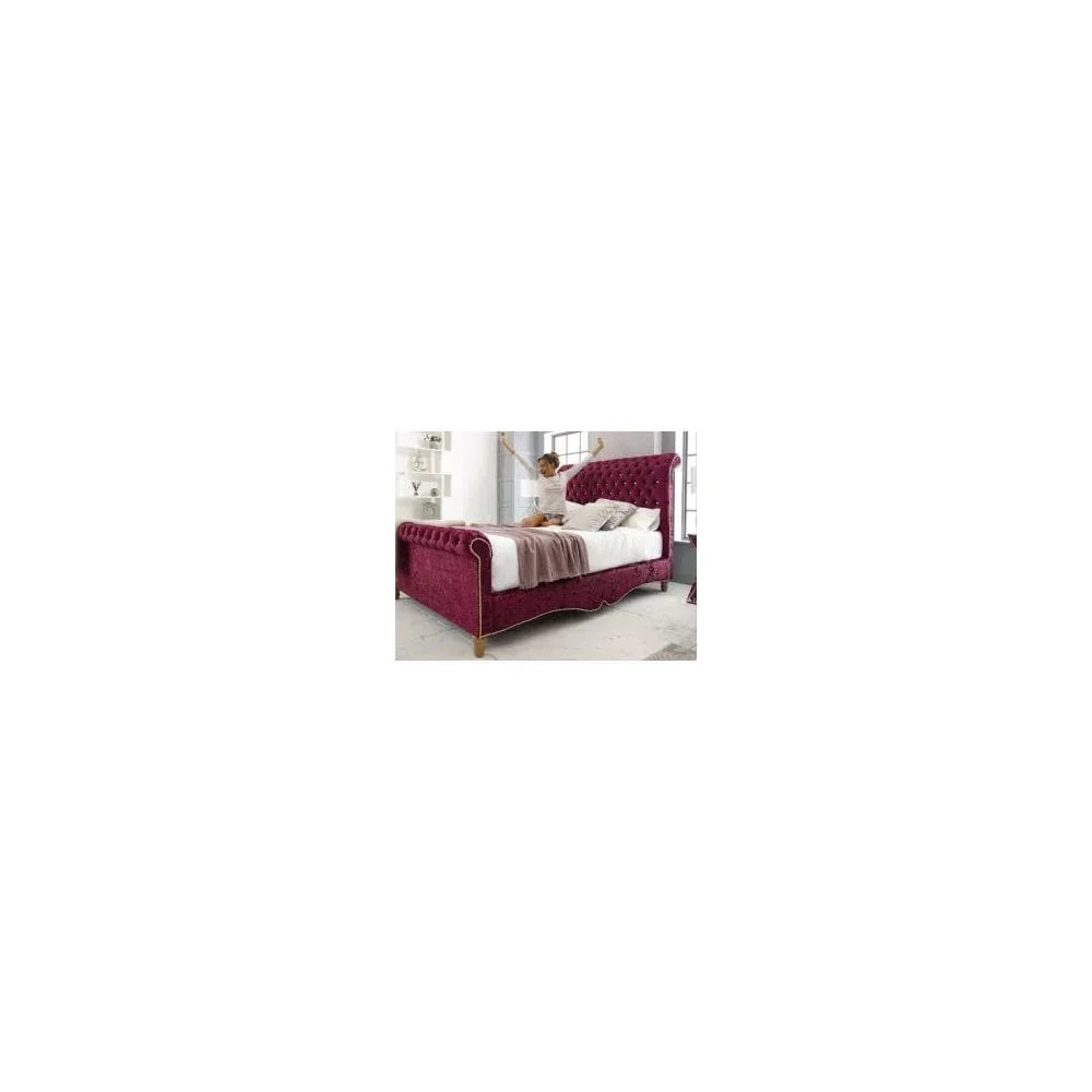 Plush burgundy velvet bed with buttoned headboard in bright bedroom