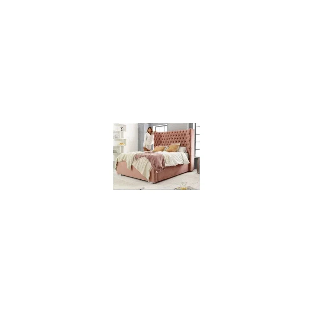Pink upholstered bed with tall buttoned headboard in modern bedroom