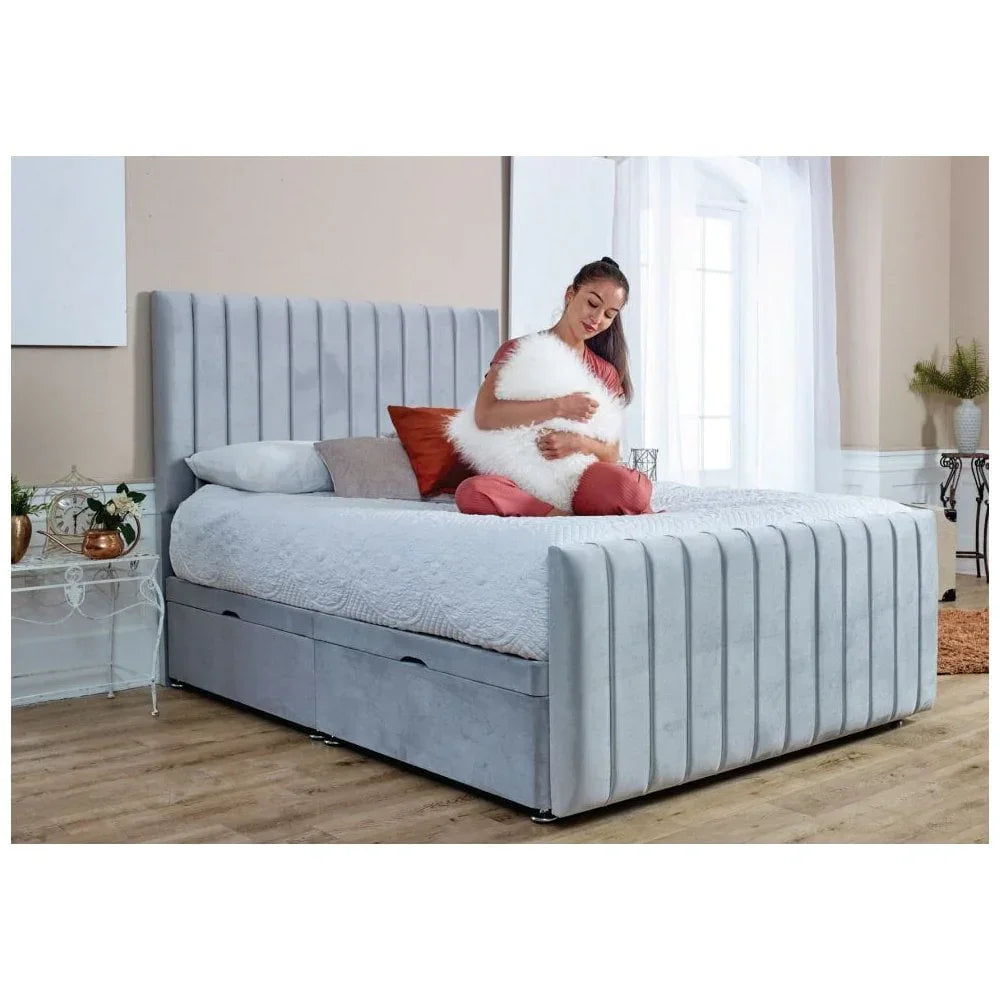 Light grey upholstered bed frame with storage drawers in modern bedroom setting