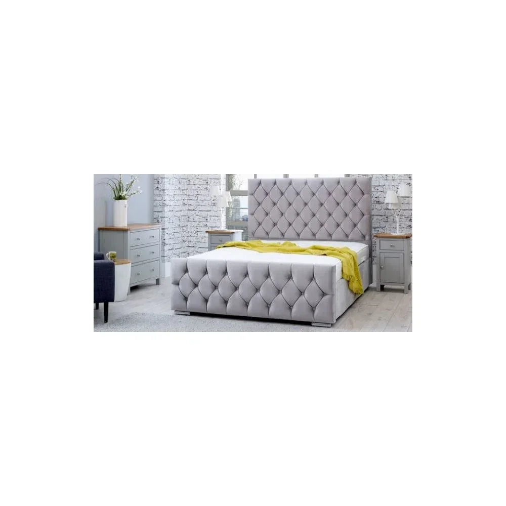 Grey upholstered bed frame with tufted headboard in modern bedroom with white brick wall