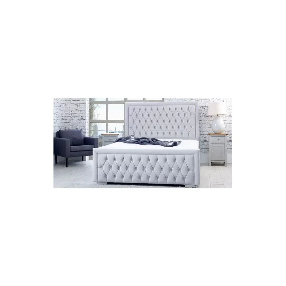 Grey upholstered bed with diamond tufted headboard in a modern bedroom setting