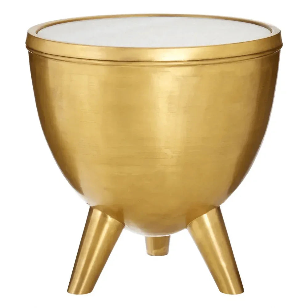 Gold metal side table with three legs and a round white top