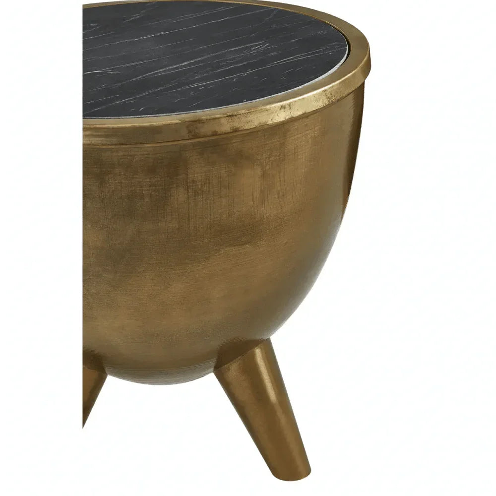 Round gold metal side table with black marble top and angled legs