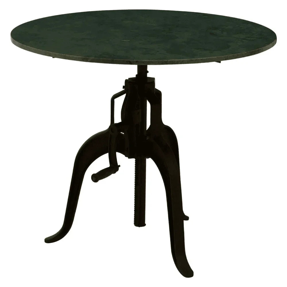 Round industrial dining table with green metal top and black adjustable tripod base