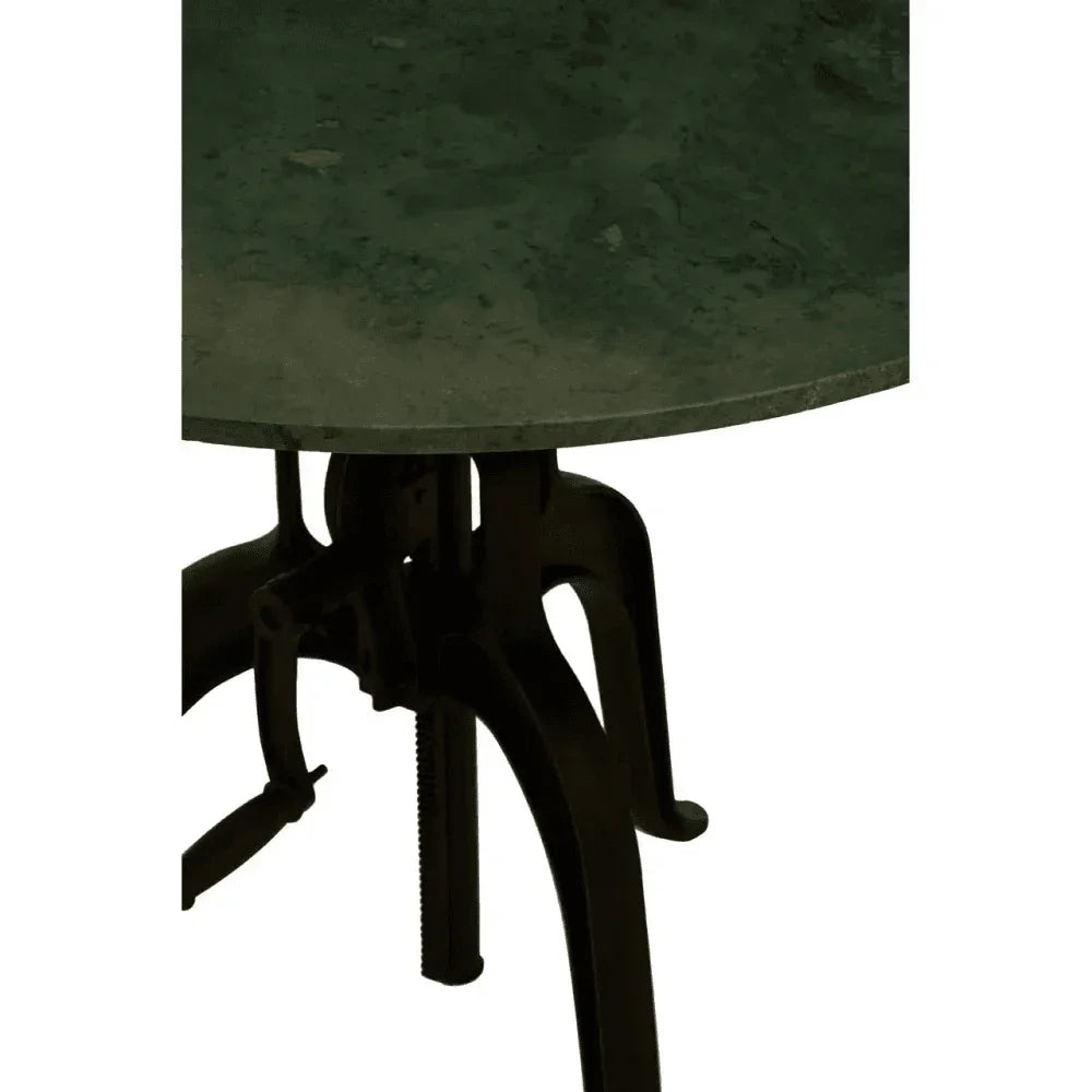 Round green marble table top with black cast iron base close-up