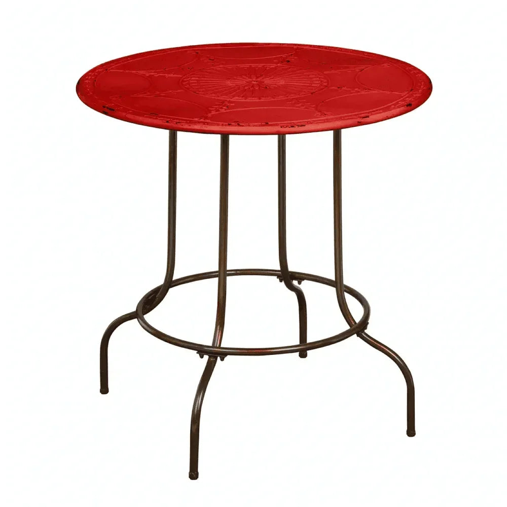Red metal garden table with round top and curved legs on white background