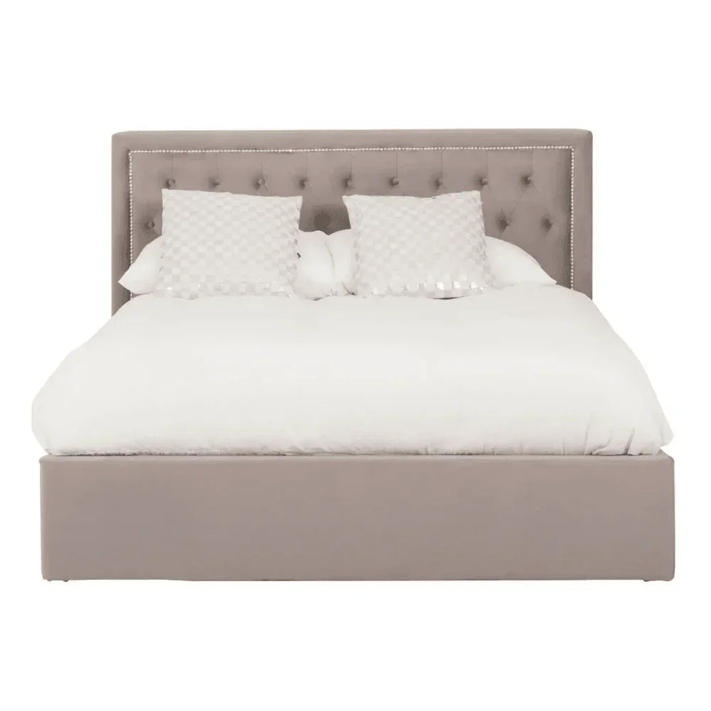 Beige upholstered bed frame with tufted headboard and white bedding, front view
