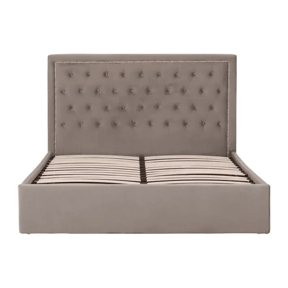Taupe upholstered bed frame with tufted headboard and decorative nail trim, slatted base view