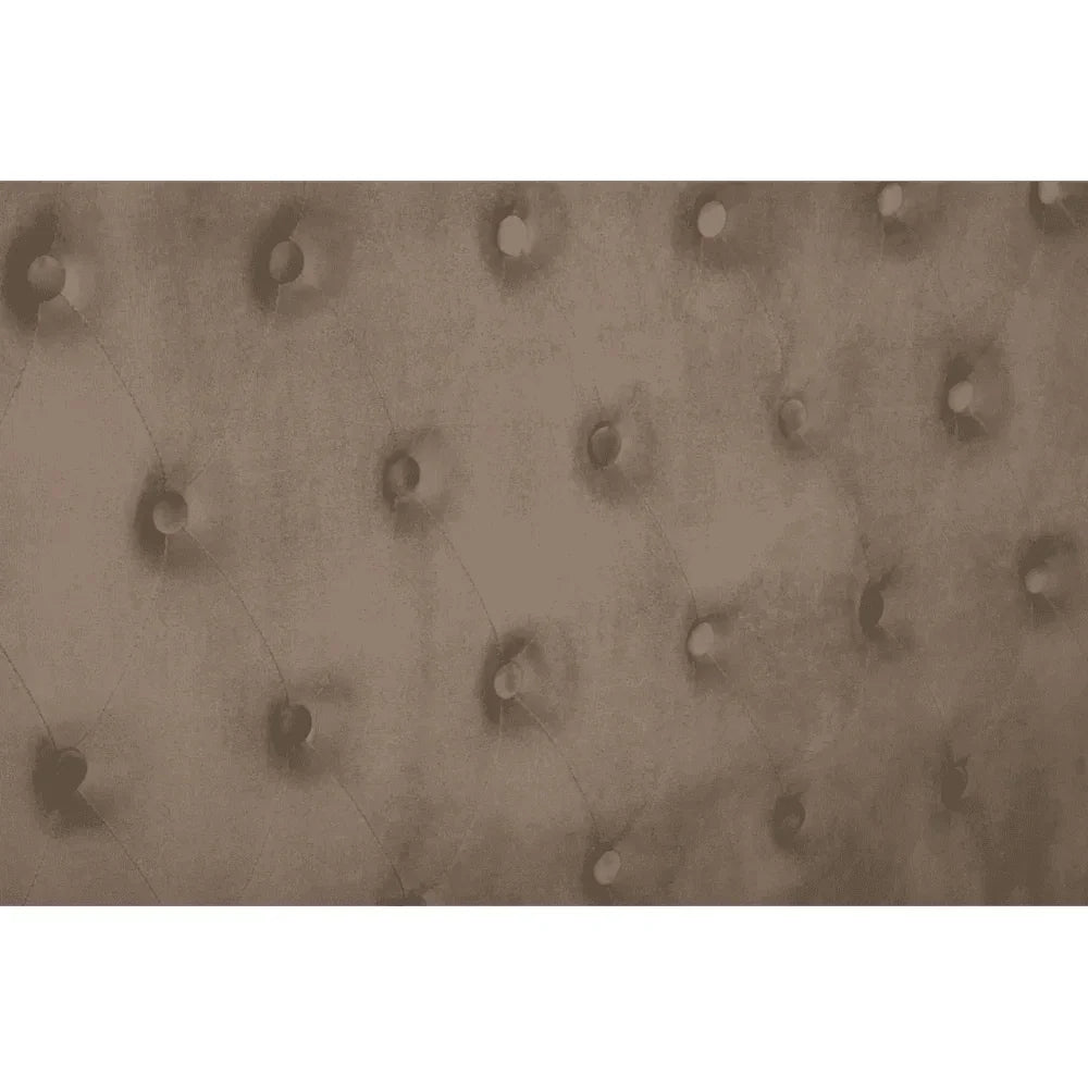 Closeup of brown velvet tufted headboard upholstery with button detail