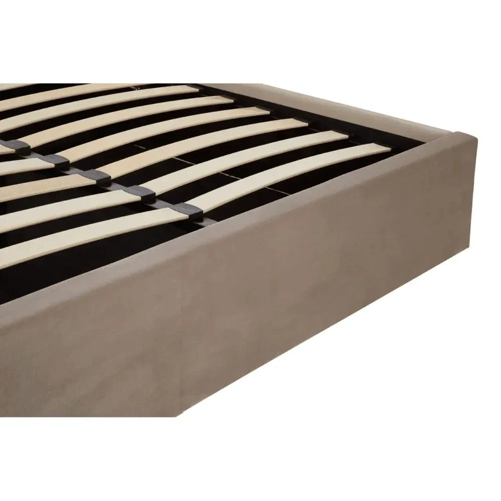 Beige upholstered bed frame corner with wooden slats and black support structure