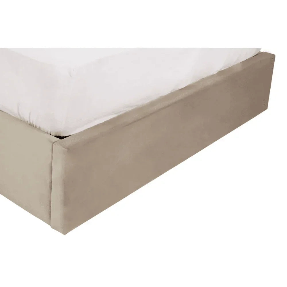 Beige upholstered bed base corner with white mattress close-up