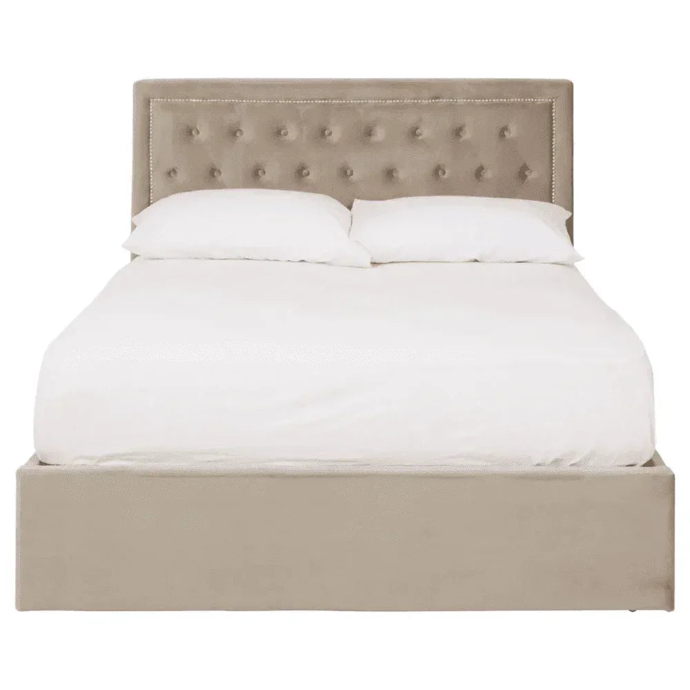 Beige upholstered bed frame with tufted headboard and white bedding, front view