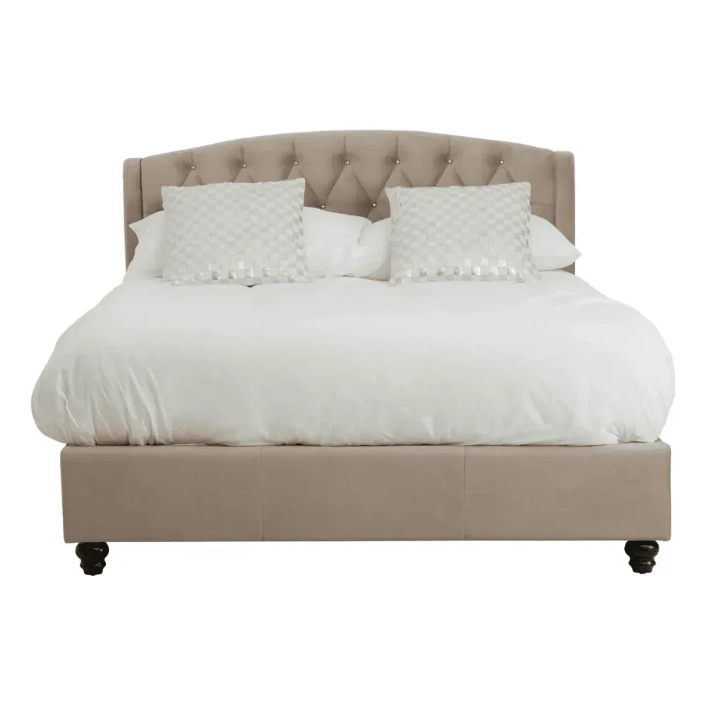 Beige upholstered bed frame with tufted headboard and white bedding, front view